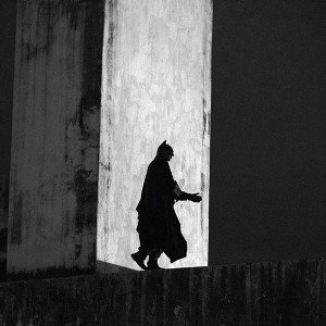 An anti-government demonstrator dressed as comic book superhero Batman walks in the Arcos da Lapa water duct during a protest against police violence in Rio de Janeiro